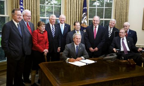 President George W. Bush signing the ADA Amendements Act in the White House.